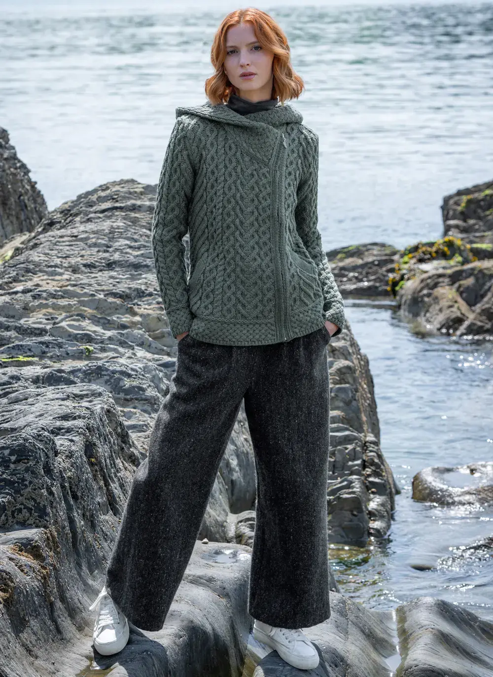 red head model at seaside in tundra aran cable knit biker hoodie full body